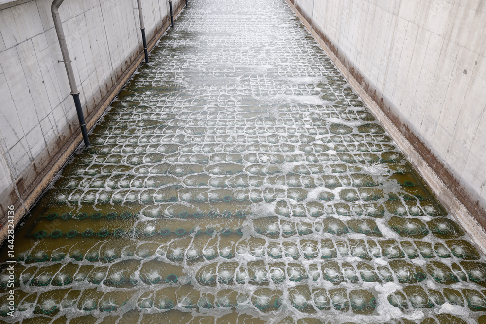 Biological treatment process in aeration basin closeup. Specialized equipment serves for breakdown of organic pollutants by infusion of oxygen