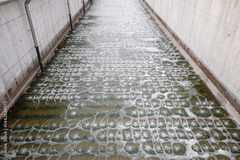 Biological treatment process in aeration basin closeup. Specialized equipment serves for breakdown of organic pollutants by infusion of oxygen