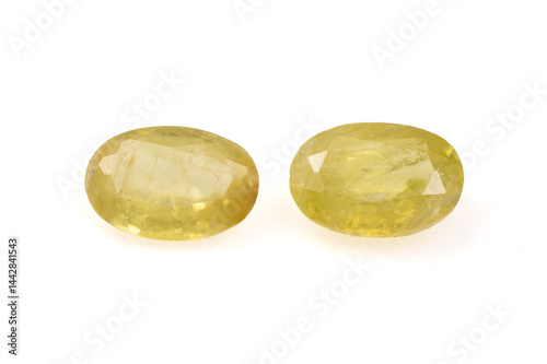 Obraz na płótnie Natural Golden Yellow Faceted Oval Sphene Gemstones on White Background w salonie