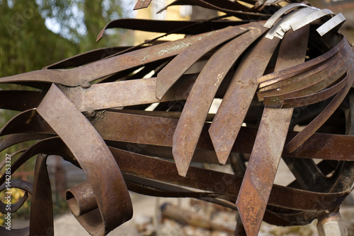 Detail of iron decoration. Differently shaped iron plates. Twisted and welded iron strips.
