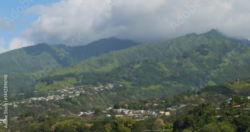 Beautiful landscape around the capital city of Papeete, Tahiti, French Polynesia.Mountains covered by clouds. photo