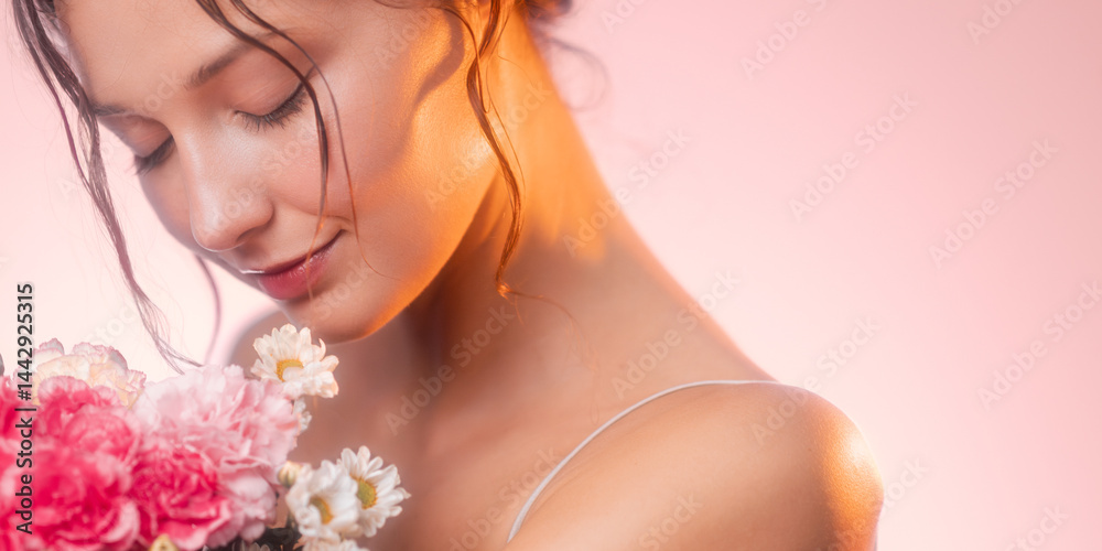 Graceful woman holding a colorful bouquet of carnations and daisies with eyes closed, radiating soft light and feminine beauty. Ideal for beauty, skincare, and romantic floral themes.