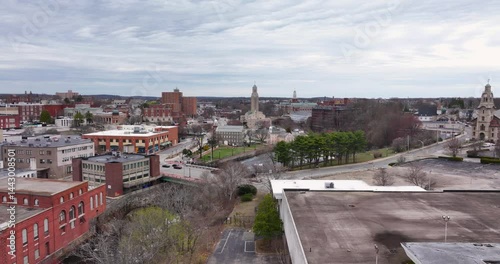 Pawtucket RI, USA - April 5, 2025:  Aerial video of the Pawtucket City Hall, Old Slater Mill National Historic Landmark on the Blackstone River.
