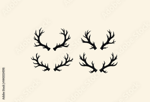 Obraz na płótnie Four Pairs of Black Antlers on Cream Background w salonie