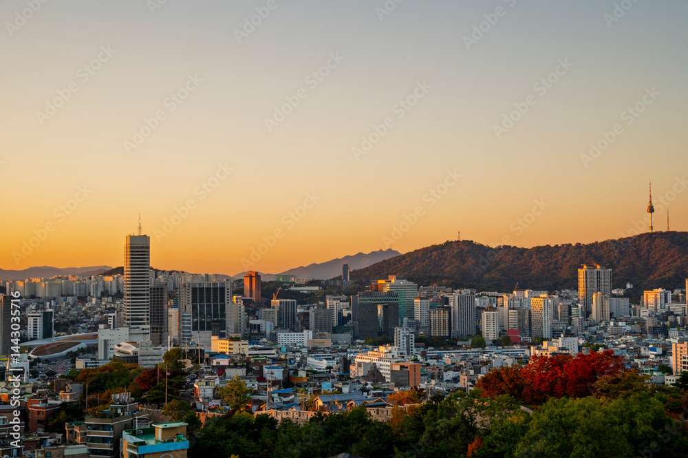 Gold sun risae or sunset of Seoul cityscapes with high rise office buildings and skyscrapers in Seoul city, Republic of Korea in winter season
