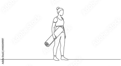 Person carrying yoga mat while preparing for a practice  