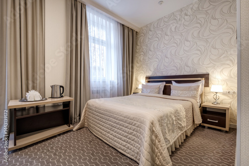 Obraz na płótnie Interior of modern luxure bedroom in studio apartments with double bed with pillows w salonie