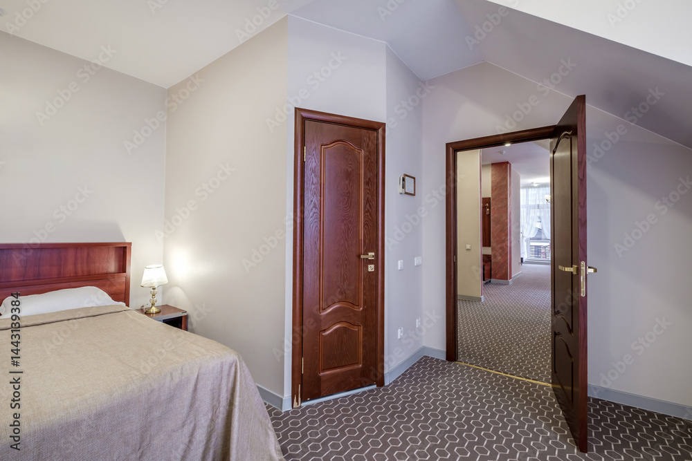 Interior of modern luxure bedroom in studio apartments with double bed with pillows