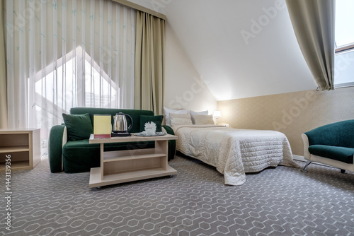 Interior of modern luxure bedroom in studio apartments with double bed with pillows