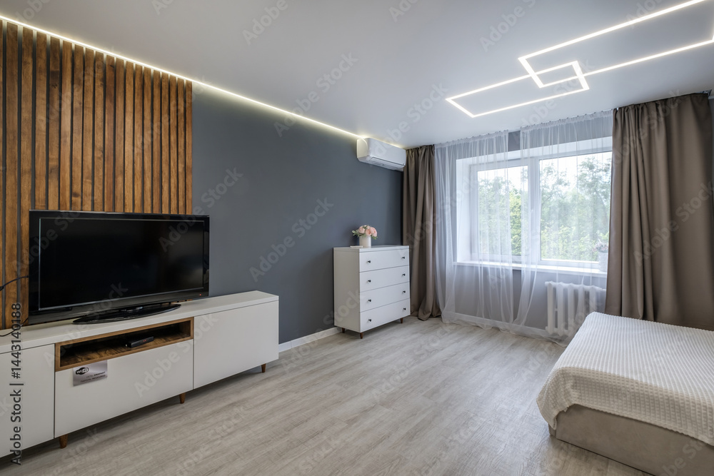 Interior of modern luxure bedroom in studio apartments with double bed with pillows