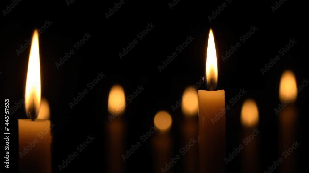 Illuminated Candles in the Dark A Row of Burning Candles, Symbol of Remembrance and Hope Illuminated Candles in the Dark A Row of Burning Candles, Symbol of Remembrance and Hope