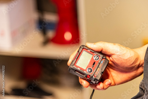 Billede på lærred Gas detector for enclosed spaces, held by a crew member aboard a merchant vessel - essential safety gear ensuring air quality and preventing life-threatening risks at sea