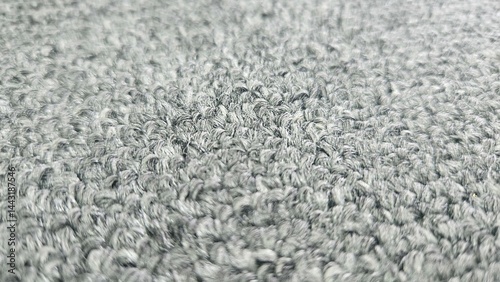 Texture of gray carpet: A close-up photograph showcases the intricate texture of a gray carpet, with its soft, inviting surface appealing to the senses and inviting exploration.