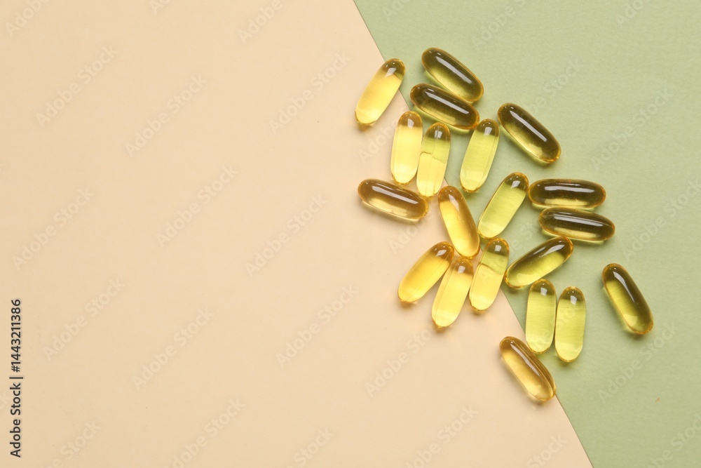 Collagen capsules on color background, top view. Space for text Collagen capsules on color background, top view. Space for text
