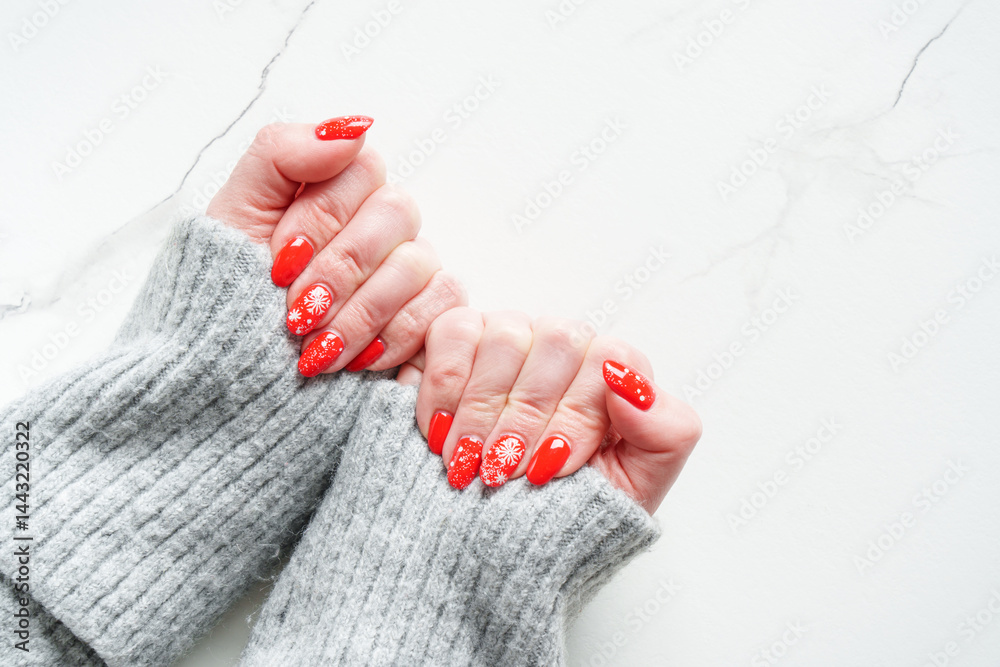 Christmas manicure, Beatiful red nails on white background.