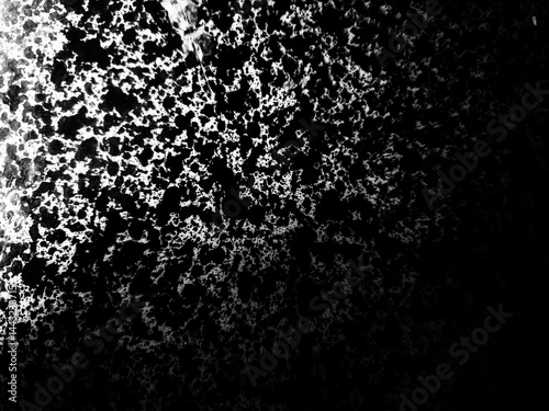 Abstract Black and White Texture: A dramatic high-contrast image featuring a textured surface with a blend of black and white tones, creating an abstract and artistic visual effect. 