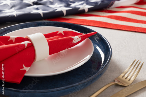 Obraz na płótnie American table setting for USA Independence Day. Festive dinner decorated in USA national flag colors white, red and blue. Close up. w salonie