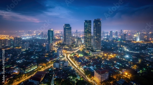 Wallpaper Mural Aerial view of a vibrant city at twilight.  A busy urban intersection, modern skyscrapers, and residential areas are visible Torontodigital.ca
