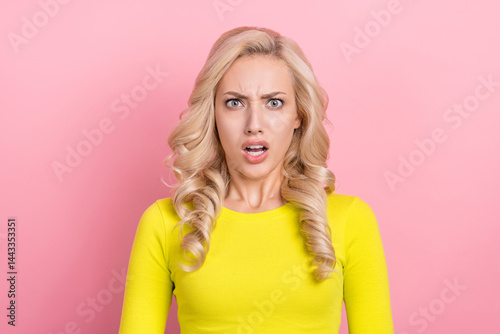 Photo of impressed speechless unsatisfied girl staring cant believe isolated on pink color background