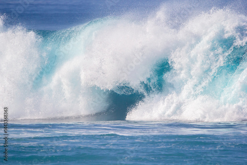 Crushing surf waves in crystal clear turquoise blue colour water close up