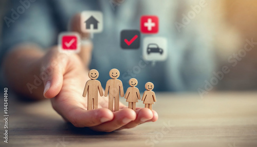 Hands Holding Wooden Family Figures with Insurance Icons