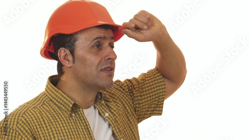 Shocked contractor adjusting hardhat in disbelief