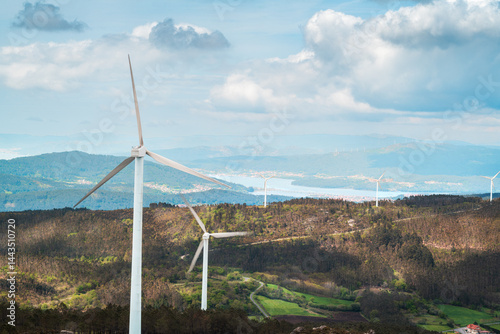 Wind turbines generating clean energy on mountain landscape