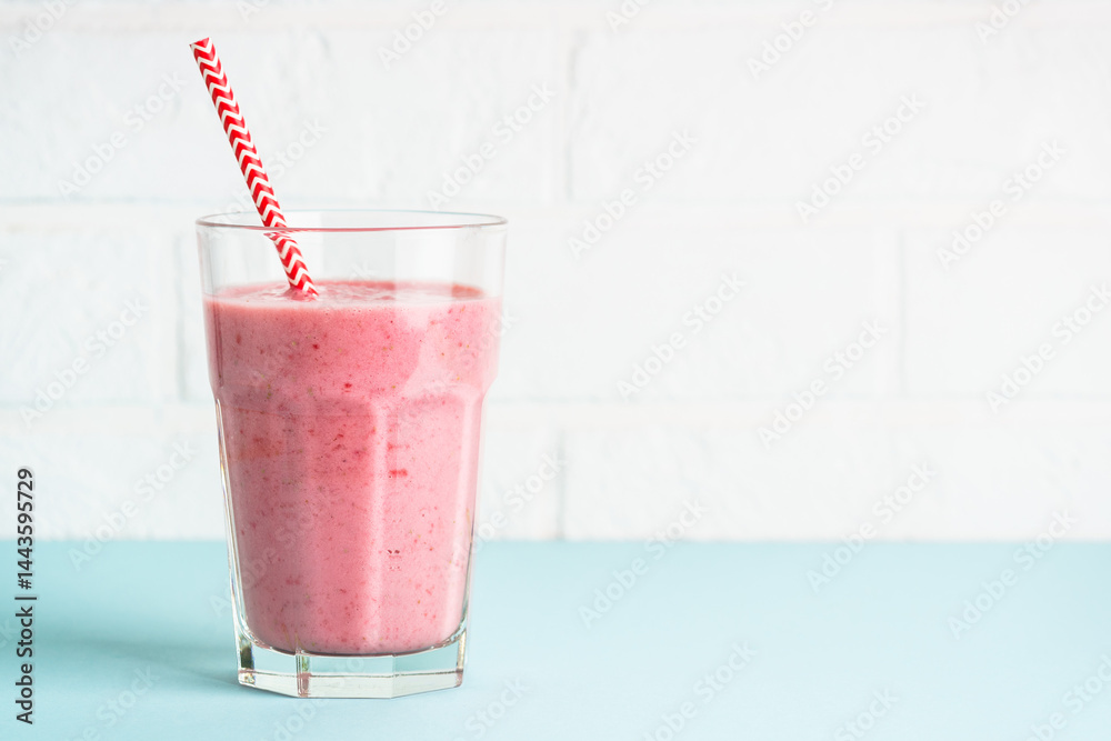 Strawberry smoothie or milkshake on white.