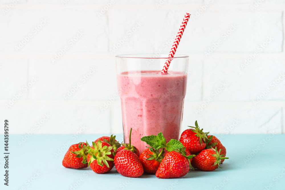Strawberry smoothie or milkshake on white.