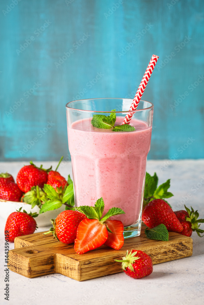 Strawberry smoothie or milkshake on white.