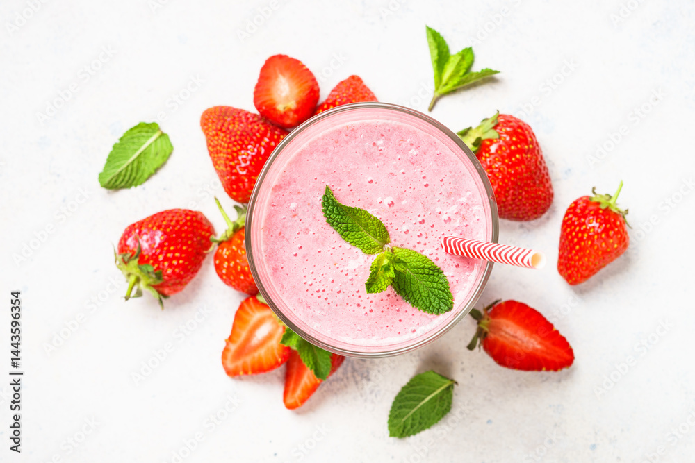 Strawberry smoothie or milkshake on white.