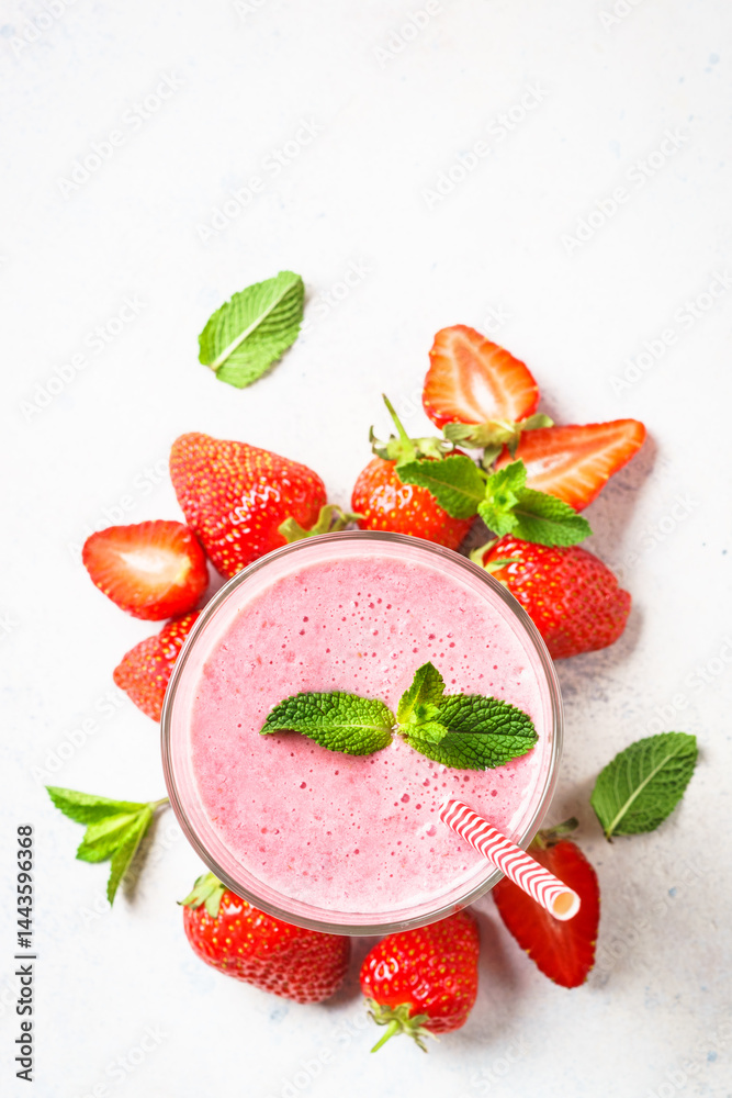 Strawberry smoothie or milkshake on white.