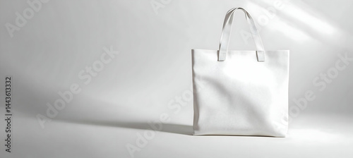 A blank canvas tote bag standing upright. The side is empty for branding. Soft fabric, realistic folds, premium quality. 