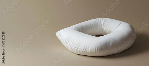 A blank travel pillow lying on a soft surface. The side is empty for branding. Premium comfort, stylish, realistic details. 