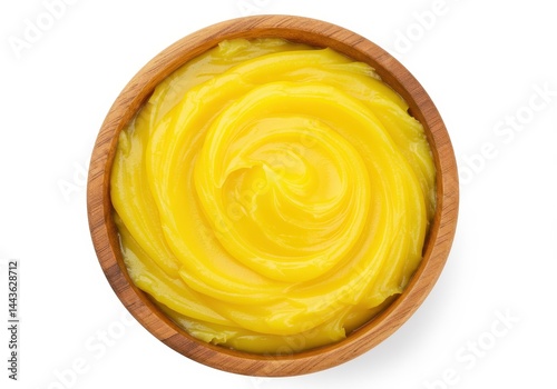 Ghee in a wooden bowl, clarified butter used in indian cuisine