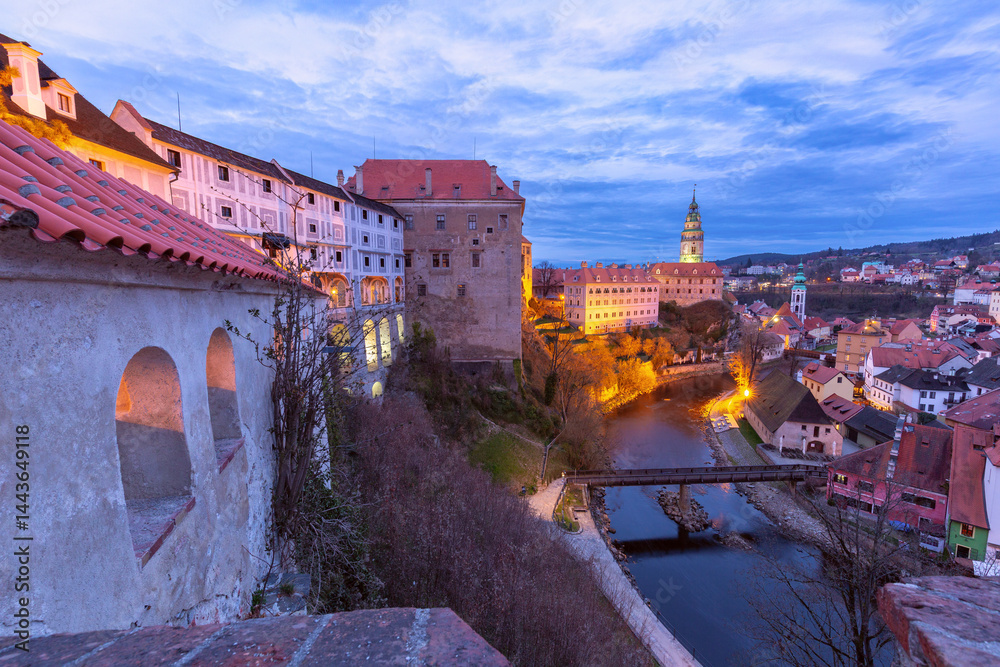 Cityscape and tower illuminated at sunset in Cesky Krumlov, Czech Republic
