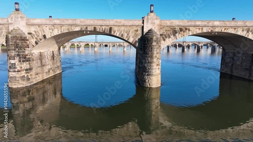 Amazing 4K aerial drone footage showcases the historic bridges spanning the Susquehanna River in Harrisburg, Pennsylvania. Filmed on April 28, 2025, this cinematic pan closeup details architecture