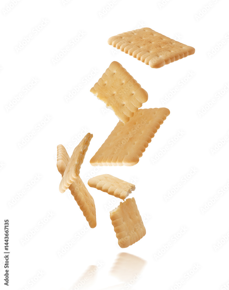 Whole and crushed crispy cookies floating in the air isolated on white background. Whole and crushed crispy cookies floating in the air isolated on white background.