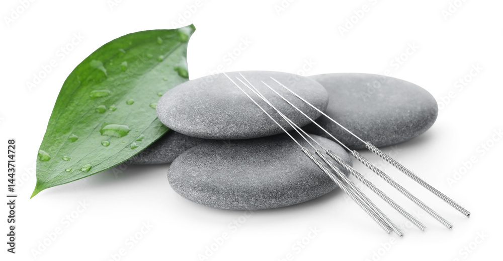Acupuncture needles, spa stones and leaf isolated on white Acupuncture needles, spa stones and leaf isolated on white