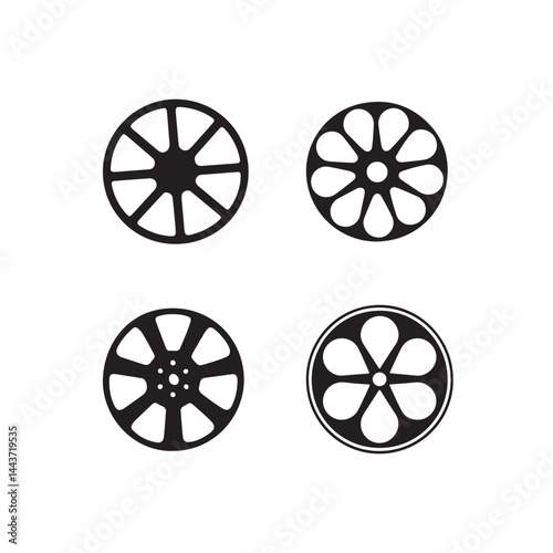 Four Classic Film Reel Icons in a Simple Vector Graphic.This graphic features four stylized, black-and-white film reel icons.