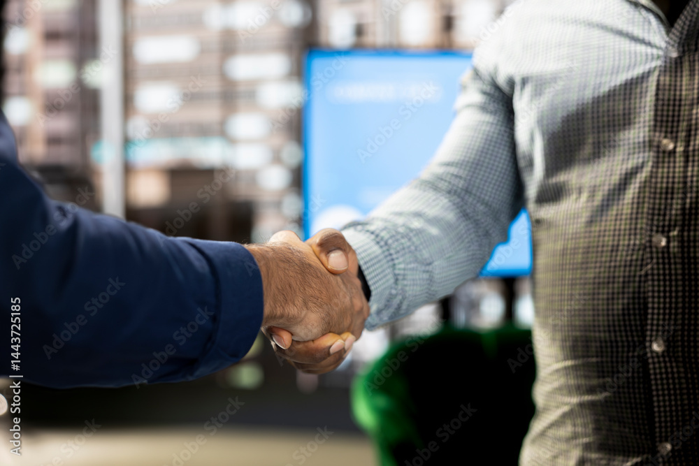 Fototapeta premium Company manager attending briefing meeting with CEO to share new ideas for profit growth, shaking hands, finalizing deal. Close up of man talking to director, doing handshake reaching agreement