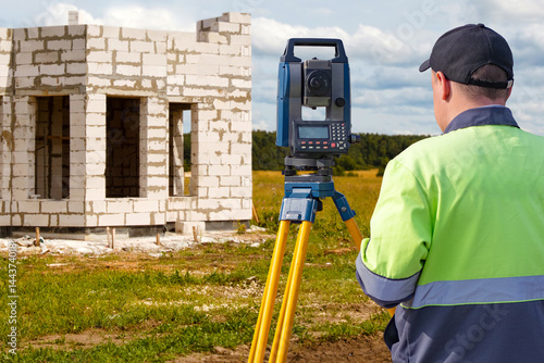 Surveyor using total statio...