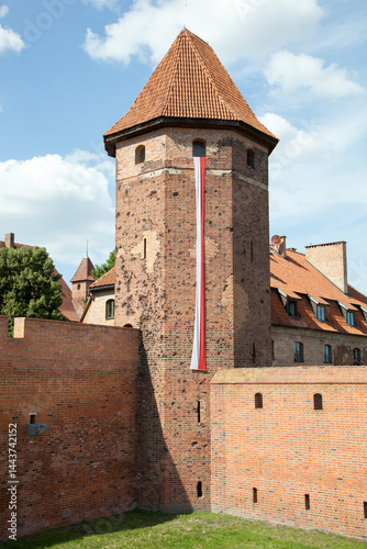 Medieval Malbork Castle Tower With a Flag Of Poland