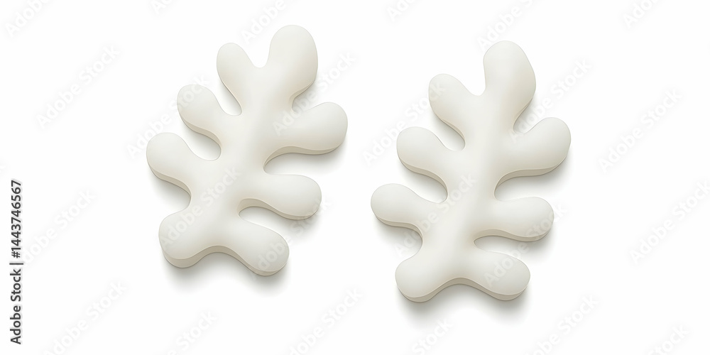 Obraz premium Two white abstract leaf-shaped objects on white background, ideal for design or craft projects