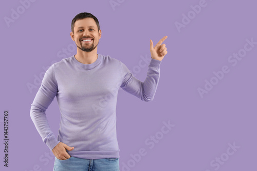 Handsome young man pointing...