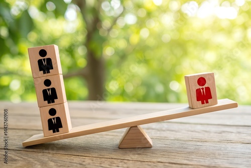 Balance of Power: Conceptual image representing imbalance in the workplace with wooden blocks on a seesaw, symbolizing workplace equity.