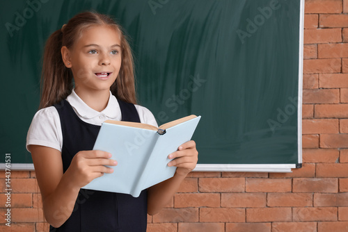 Cute little girl in school ...