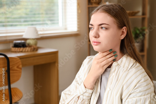 Young woman self-examining ...