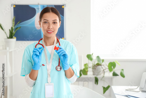 Young female doctor holding...