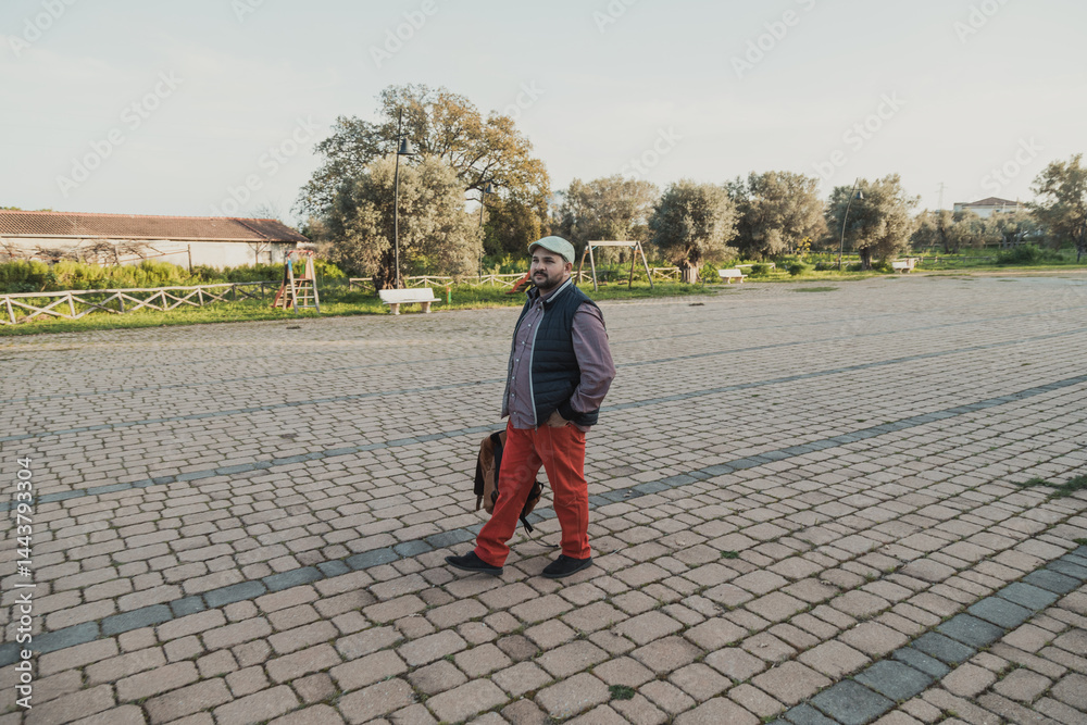 Photgrapher Walking In The Park With A Backpack
